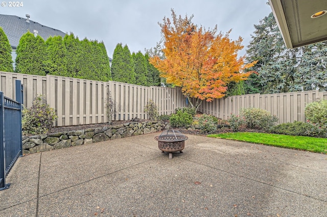 view of patio / terrace with an outdoor fire pit