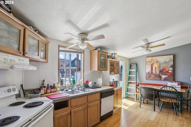 kitchen with dishwasher, vaulted ceiling, light hardwood / wood-style floors, white electric range oven, and sink