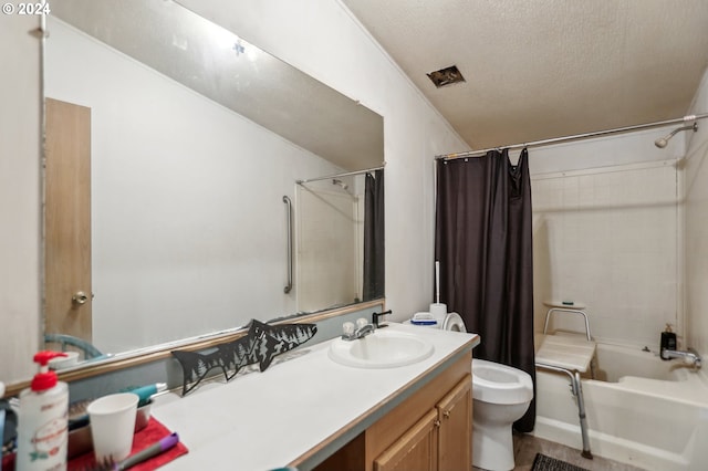 full bathroom featuring a textured ceiling, shower / tub combo with curtain, hardwood / wood-style flooring, toilet, and vanity