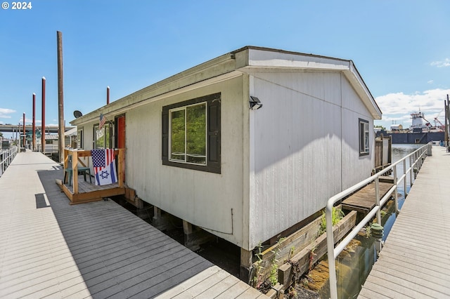 view of side of home featuring a water view