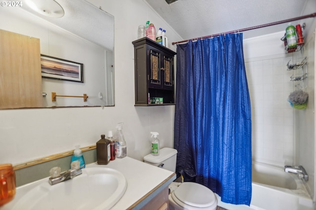 full bathroom featuring toilet, vanity, a textured ceiling, and shower / bath combo with shower curtain