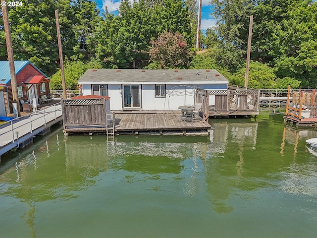 dock area with a deck with water view