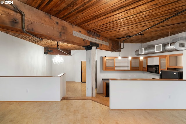 kitchen with pendant lighting, refrigerator, and wood ceiling