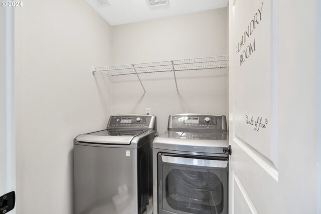 2067 NE 49th Way, Hillsboro, OR 97124 - clothes washing area featuring washer and dryer