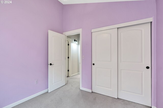 2067 NE 49th Way, Hillsboro, OR 97124 - unfurnished bedroom featuring light colored carpet, baseboards, and a closet