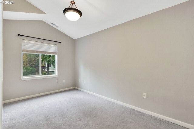 2067 NE 49th Way, Hillsboro, OR 97124 - carpeted spare room with vaulted ceiling and baseboards