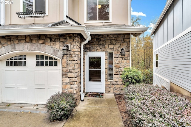 2067 NE 49th Way, Hillsboro, OR 97124 - doorway to property featuring stone siding and board and batten siding