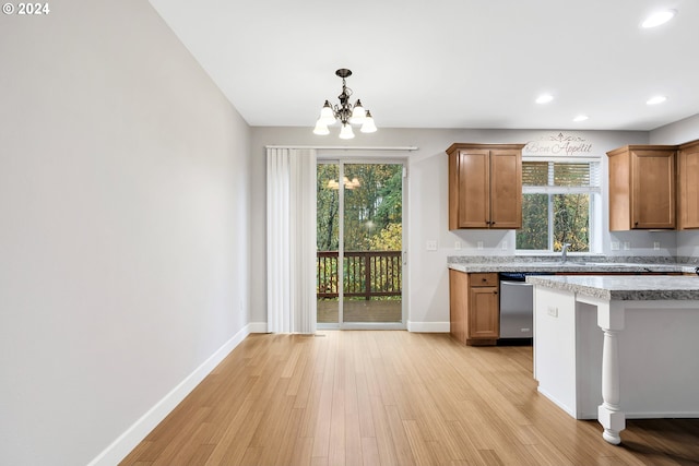 2067 NE 49th Way, Hillsboro, OR 97124 - kitchen featuring stainless steel dishwasher, a chandelier, baseboards, light wood-style flooring, and recessed lighting