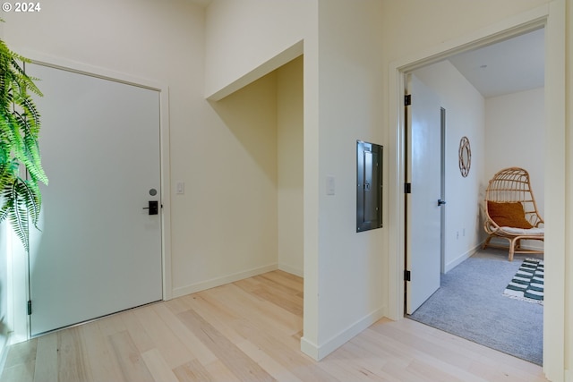 entrance foyer featuring electric panel and light hardwood / wood-style floors