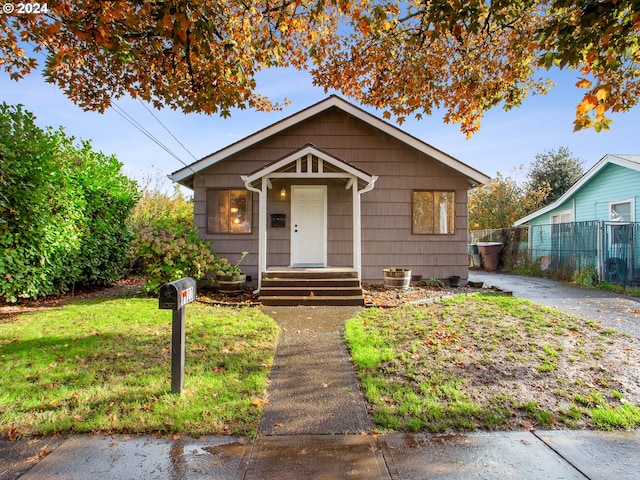 bungalow with a front yard