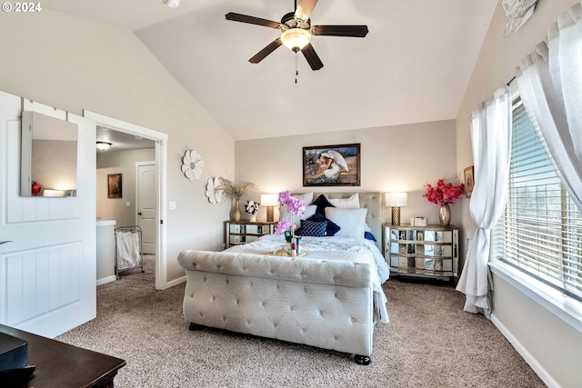 bedroom featuring vaulted ceiling, light colored carpet, and ceiling fan