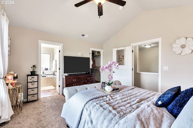 bedroom with a closet, a spacious closet, ceiling fan, light carpet, and vaulted ceiling