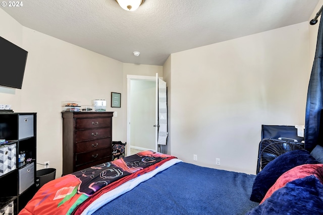 bedroom featuring a textured ceiling