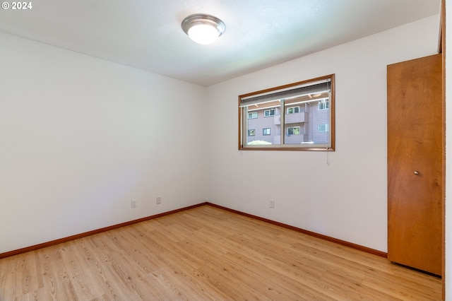 spare room with light wood-type flooring