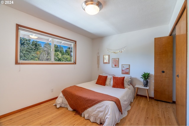 bedroom with light hardwood / wood-style floors