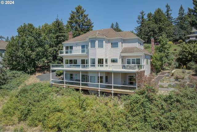 back of house with a balcony