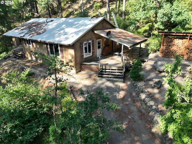 view of front of house featuring a deck and metal roof