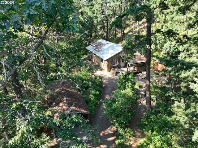 aerial view featuring a wooded view