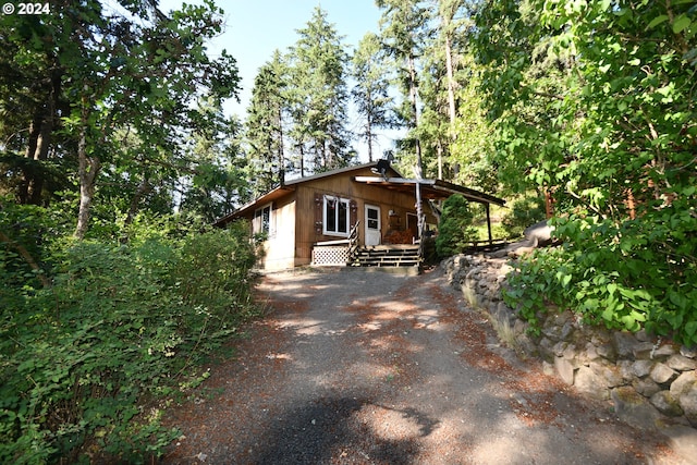 view of side of home with driveway