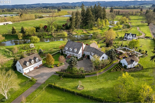 bird's eye view featuring a water view and a rural view