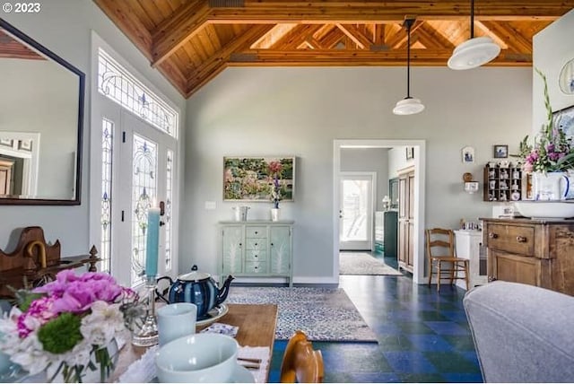 foyer featuring wood ceiling, plenty of natural light, and high vaulted ceiling