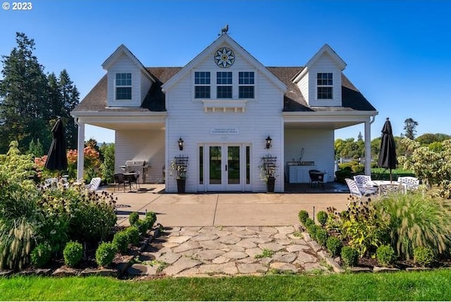 back of house featuring a patio and french doors