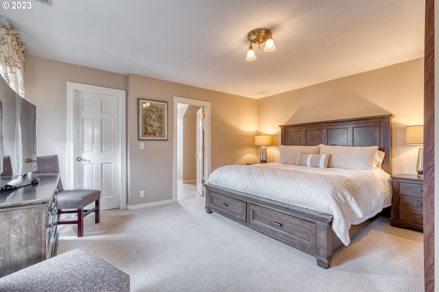 bedroom with light colored carpet