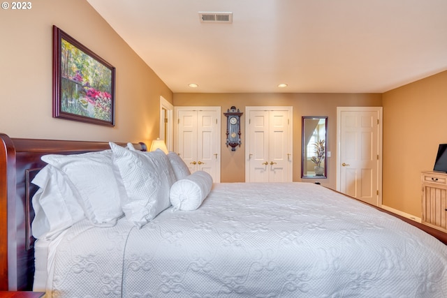 bedroom featuring two closets