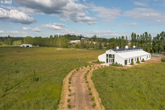 birds eye view of property featuring a rural view