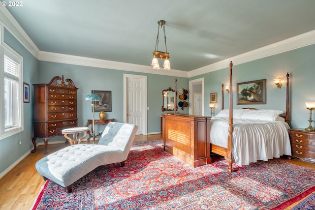 bedroom with ornamental molding, a notable chandelier, and light wood-type flooring