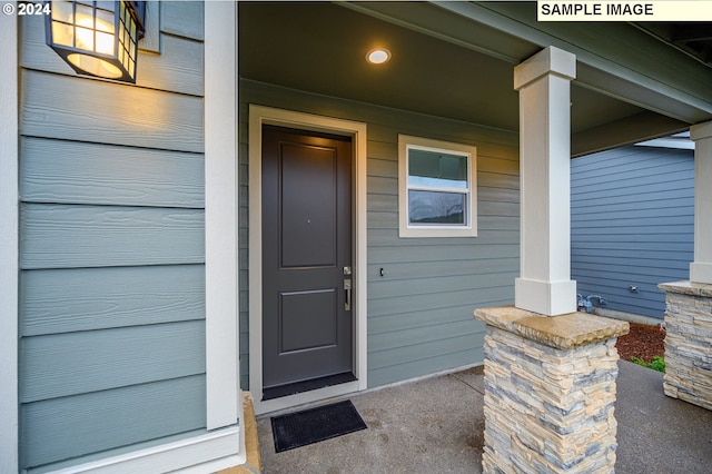 property entrance with covered porch