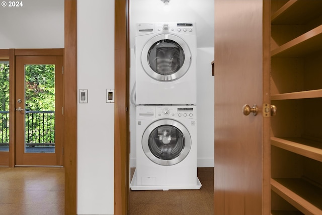 laundry room with stacked washer and clothes dryer