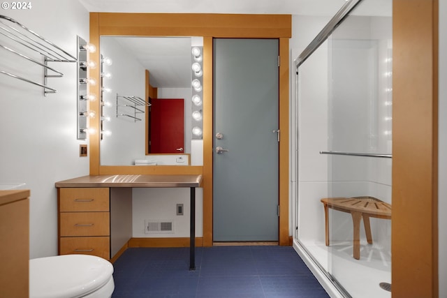 bathroom featuring walk in shower, vanity, and toilet