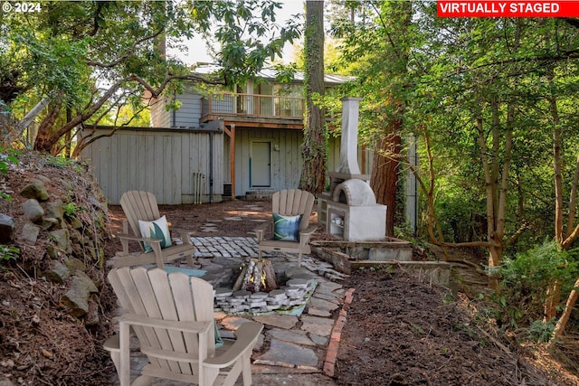 view of yard with a balcony and a patio area