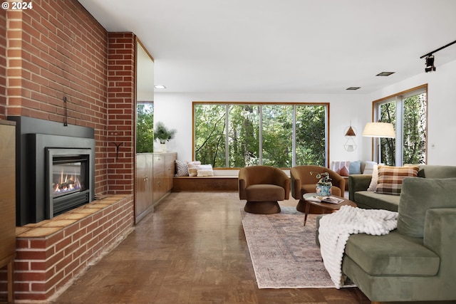 living room with a fireplace and parquet flooring