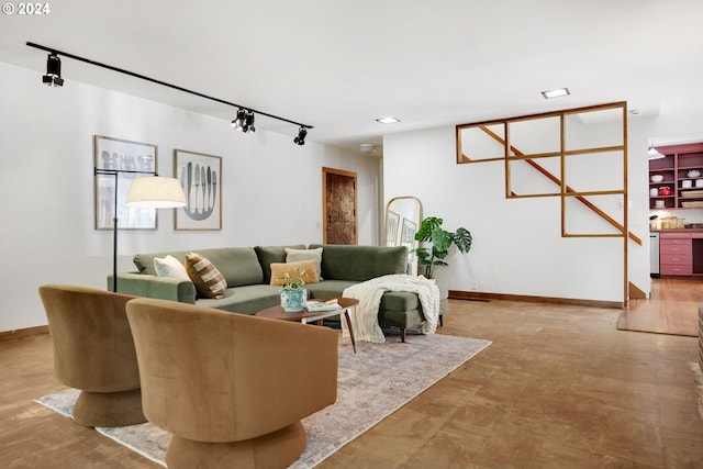 living room featuring light hardwood / wood-style floors and rail lighting