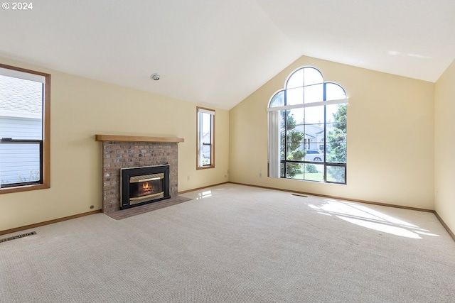 unfurnished living room featuring lofted ceiling and light carpet