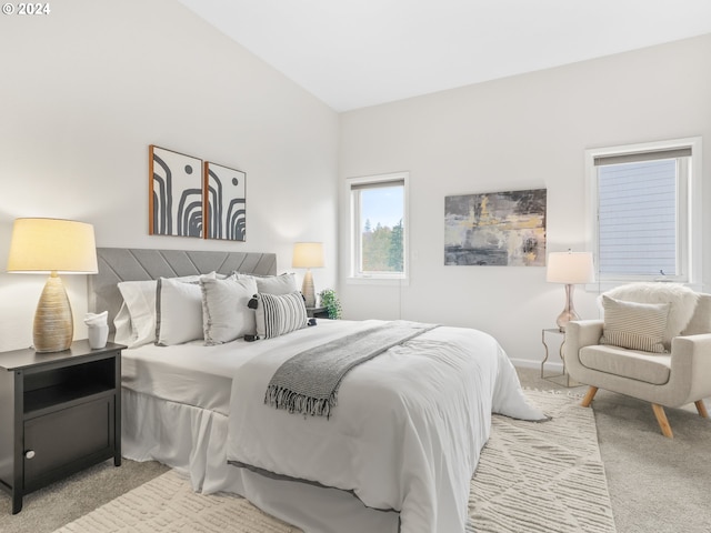 carpeted bedroom with vaulted ceiling