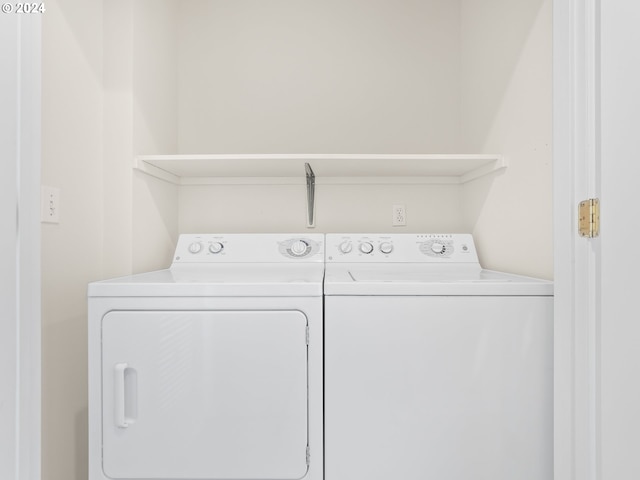 laundry area with independent washer and dryer