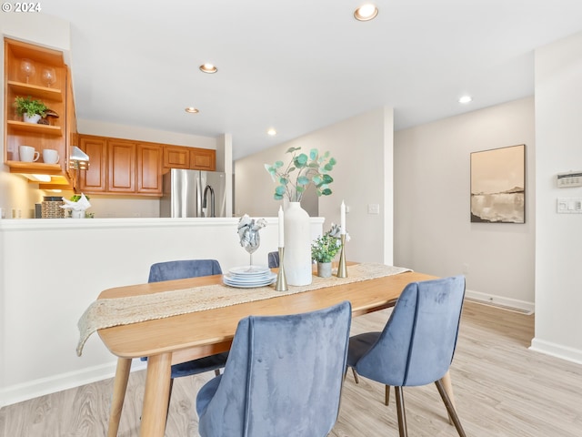 dining space featuring light hardwood / wood-style flooring