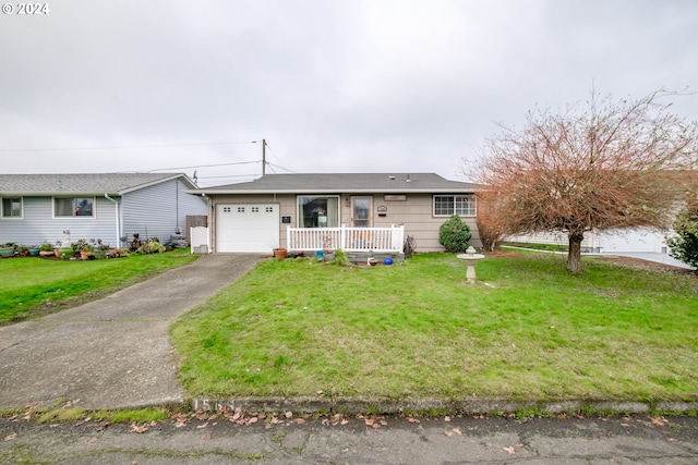 single story home with a front yard and a garage