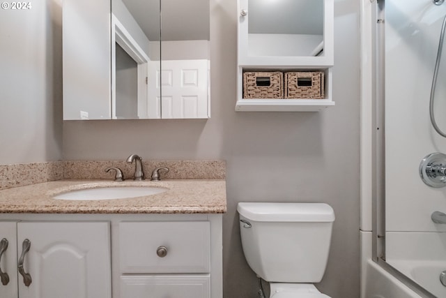 full bathroom with vanity, toilet, and bathtub / shower combination