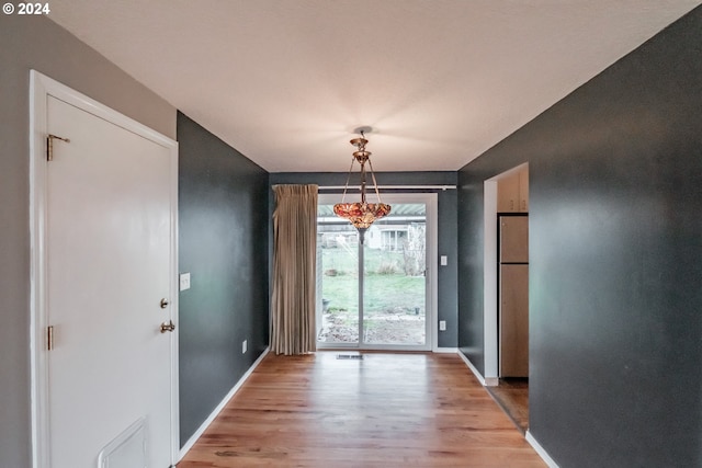 doorway to outside with light hardwood / wood-style floors