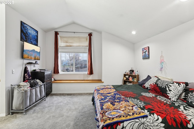 carpeted bedroom with lofted ceiling