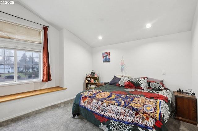 bedroom with lofted ceiling and carpet flooring