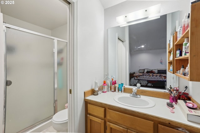 bathroom with walk in shower, vanity, and toilet