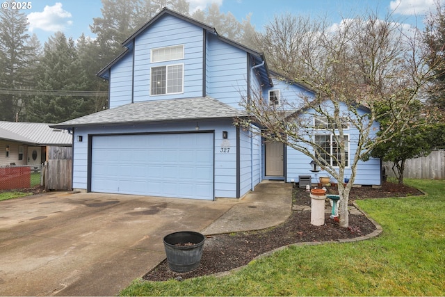 front facade featuring a garage and a front lawn