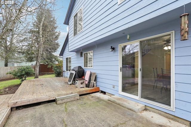 view of patio with a deck and a grill