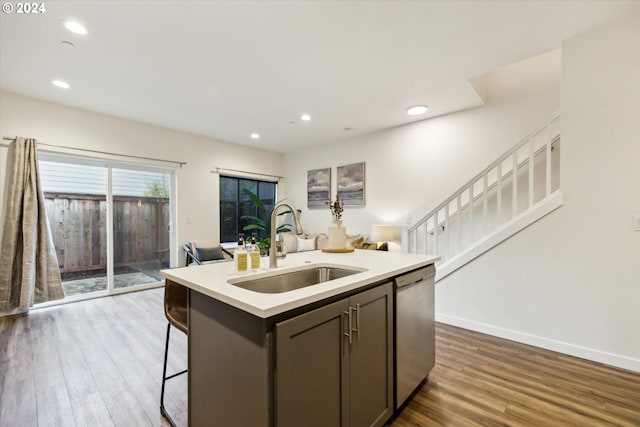 2828 22nd Ave Unit 10, Forest Grove, OR 97116 - kitchen featuring a sink, stainless steel dishwasher, dark wood-style floors, light countertops, and a center island with sink
