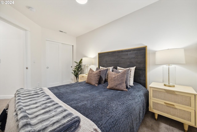 carpeted bedroom featuring a closet